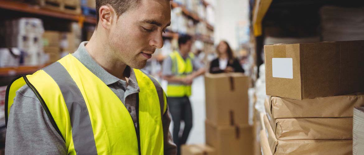 bigstock-Warehouse-worker-scanning-box-121244318.jpg